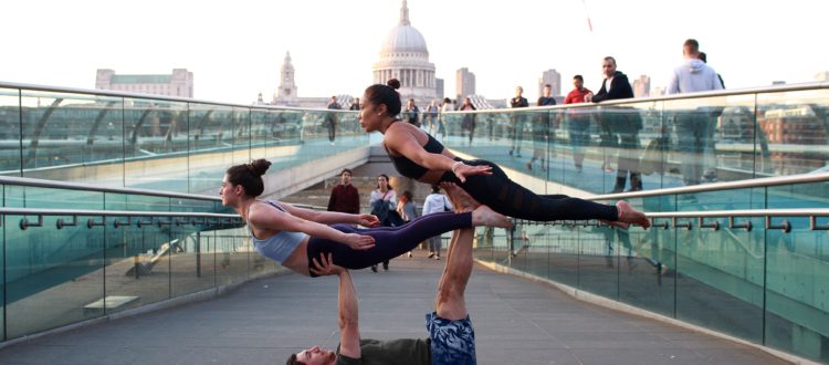 man-lifted-two-women-in-middle-of-pathway-1139502